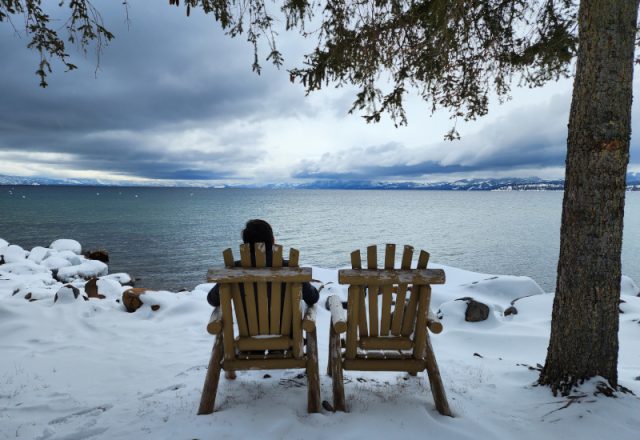 Person sitting watching Lake Tahoe weather conditions